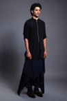 Sleek black kurta with a bold blue draped pant skirt, offering a stylish and contemporary look.