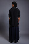 Black kurta with a unique blue draped pant skirt, combining classic design with modern elements.