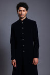 Elegant black velvet sherwani featuring contemporary gunmetal buttons, perfect for formal occasions