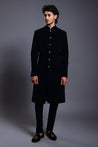 Classic black velvet sherwani with stylish gunmetal buttons, combining traditional elegance with modern refinement.