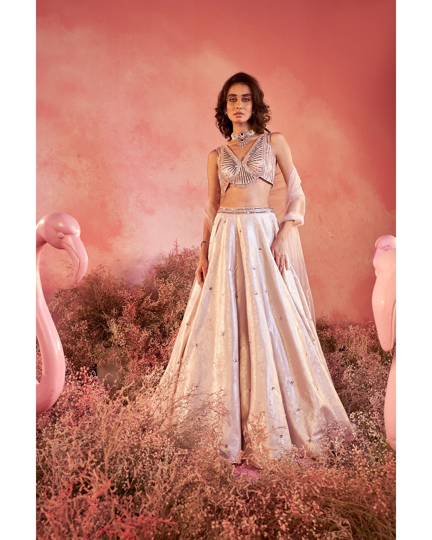 Whispers of elegance in soft pink hues, each stitch telling a story of meticulous hand embroidery. A timeless blend of grace and craftsmanship.