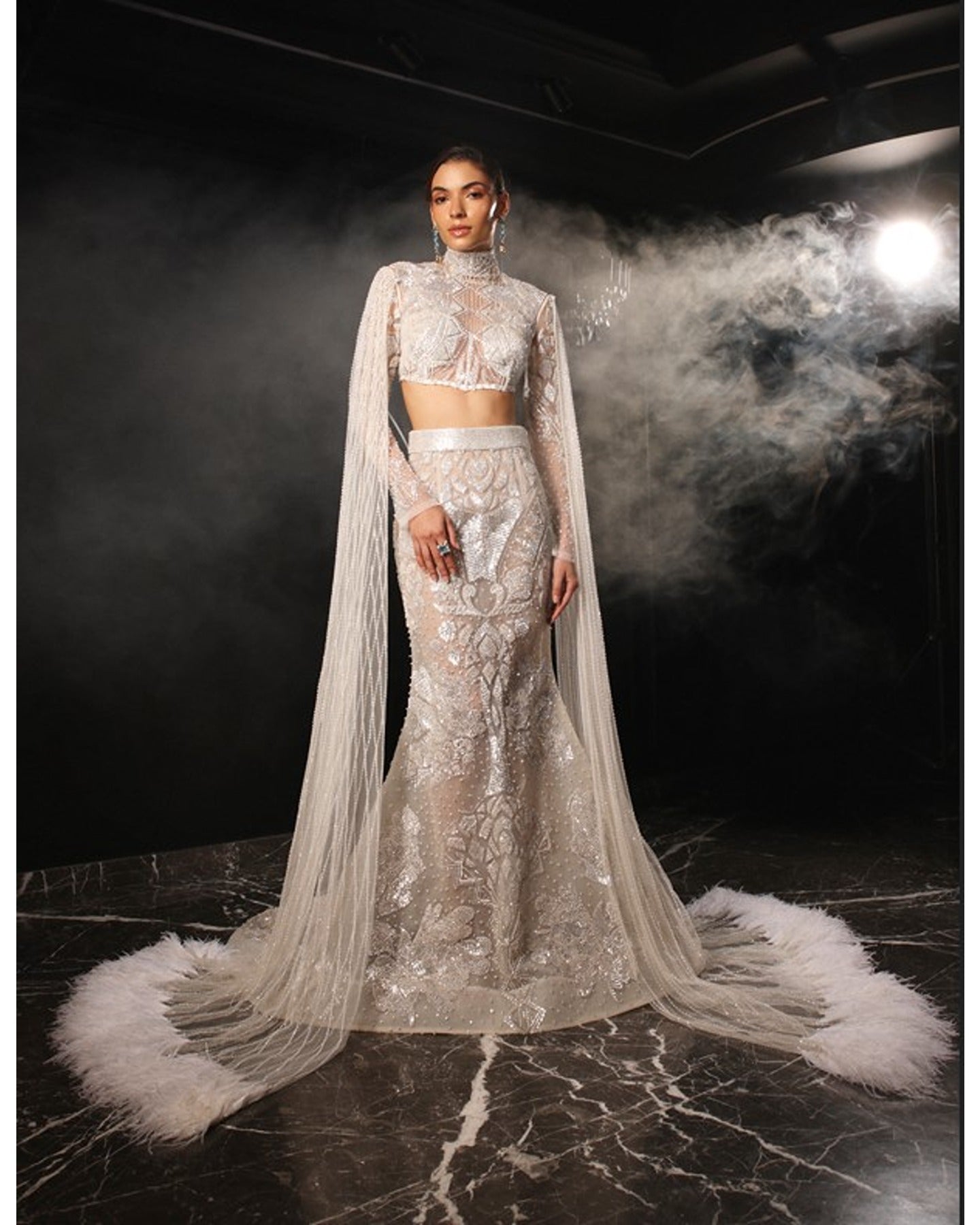 White, gold and silver applique work fish cut gown available only at  Pernia's Pop Up Shop. 2024