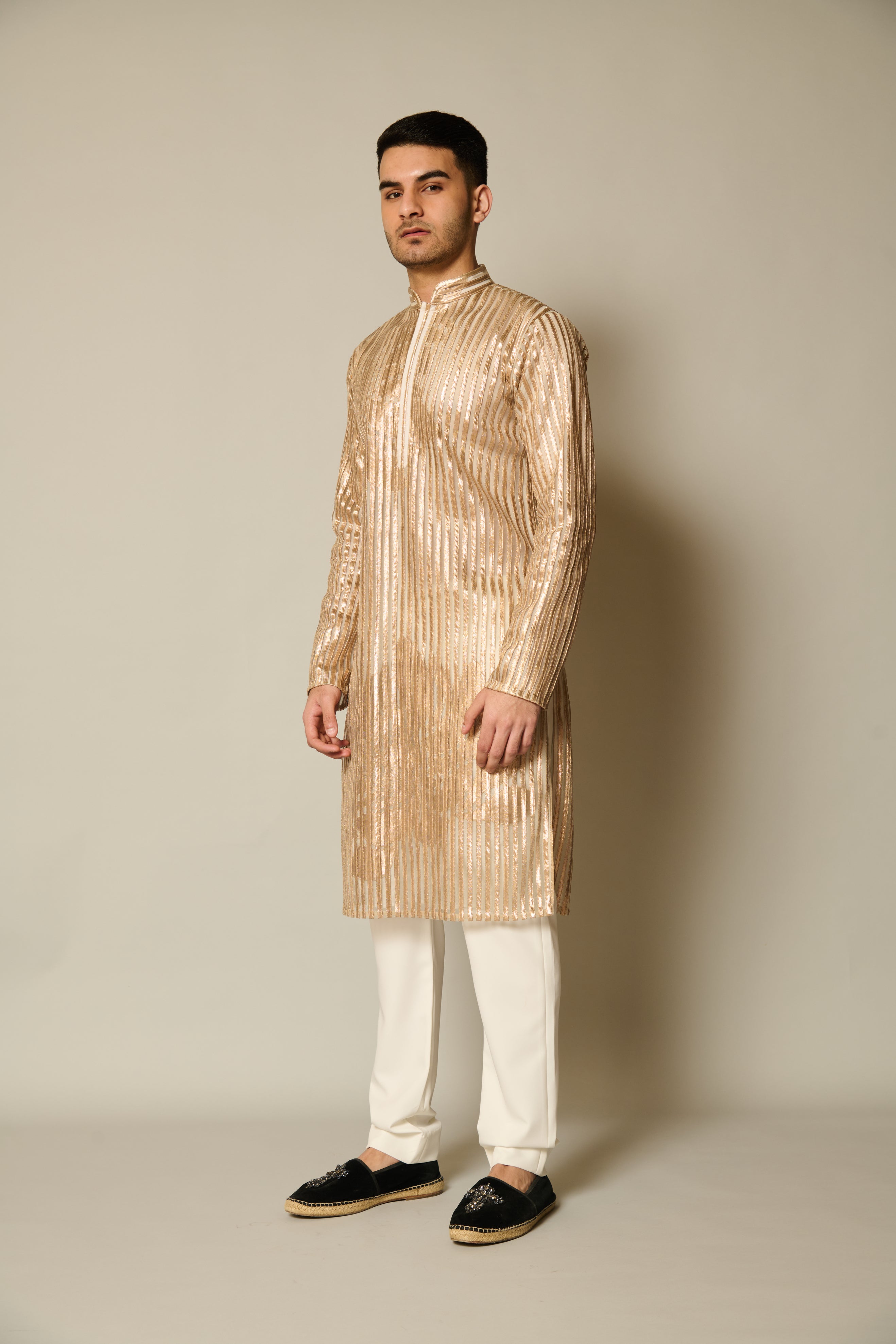 Stylish gold kurta adorned with shadow work and ornate gold floral applique accents