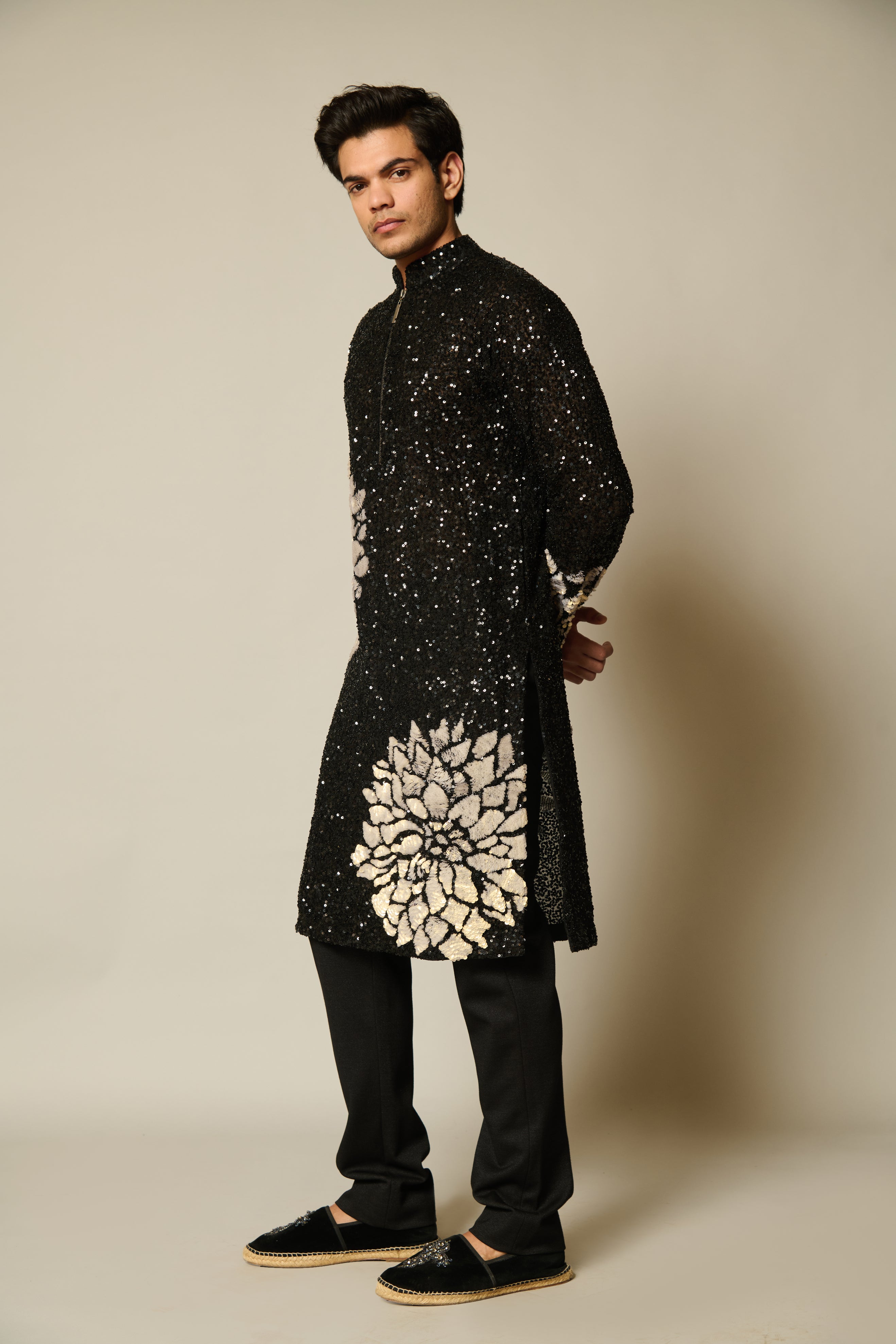 Chic black kurta featuring intricate sequin embroidery and delicate ivory 3D flowers