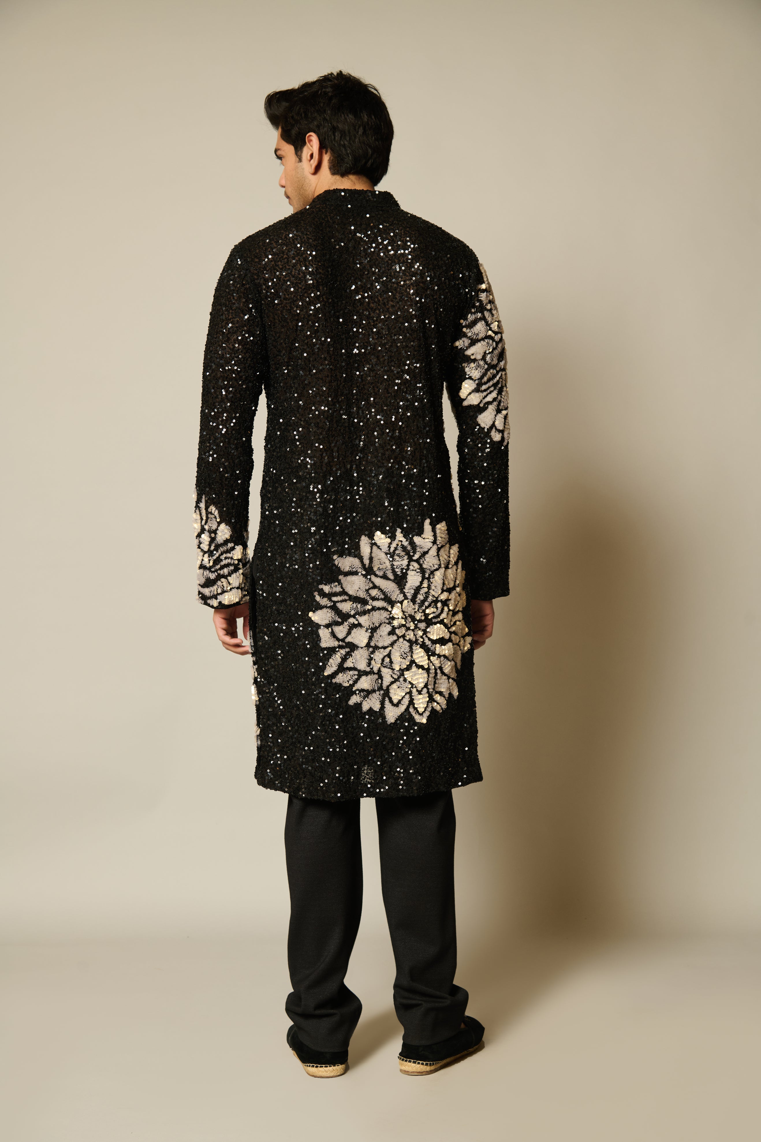 Stylish black kurta with sequin embellishments, highlighted by elegant ivory 3D floral designs