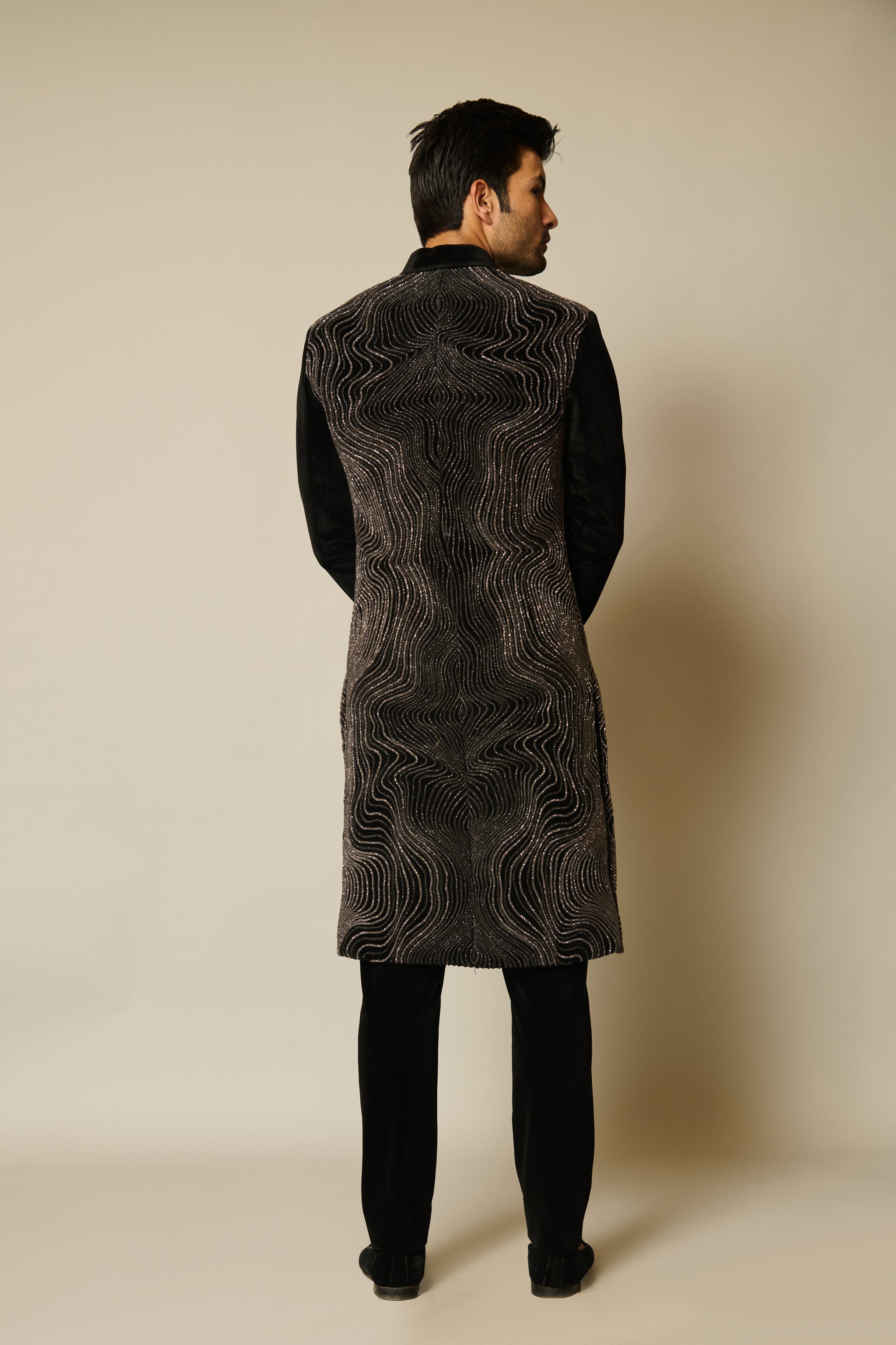 Elegant neoprene mesh sherwani featuring gradient velvet strip work and intricate black crystal rope detailing