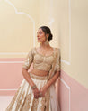 Ivory raw silk lehenga set with exquisite floral embroidery and a flowing skirt