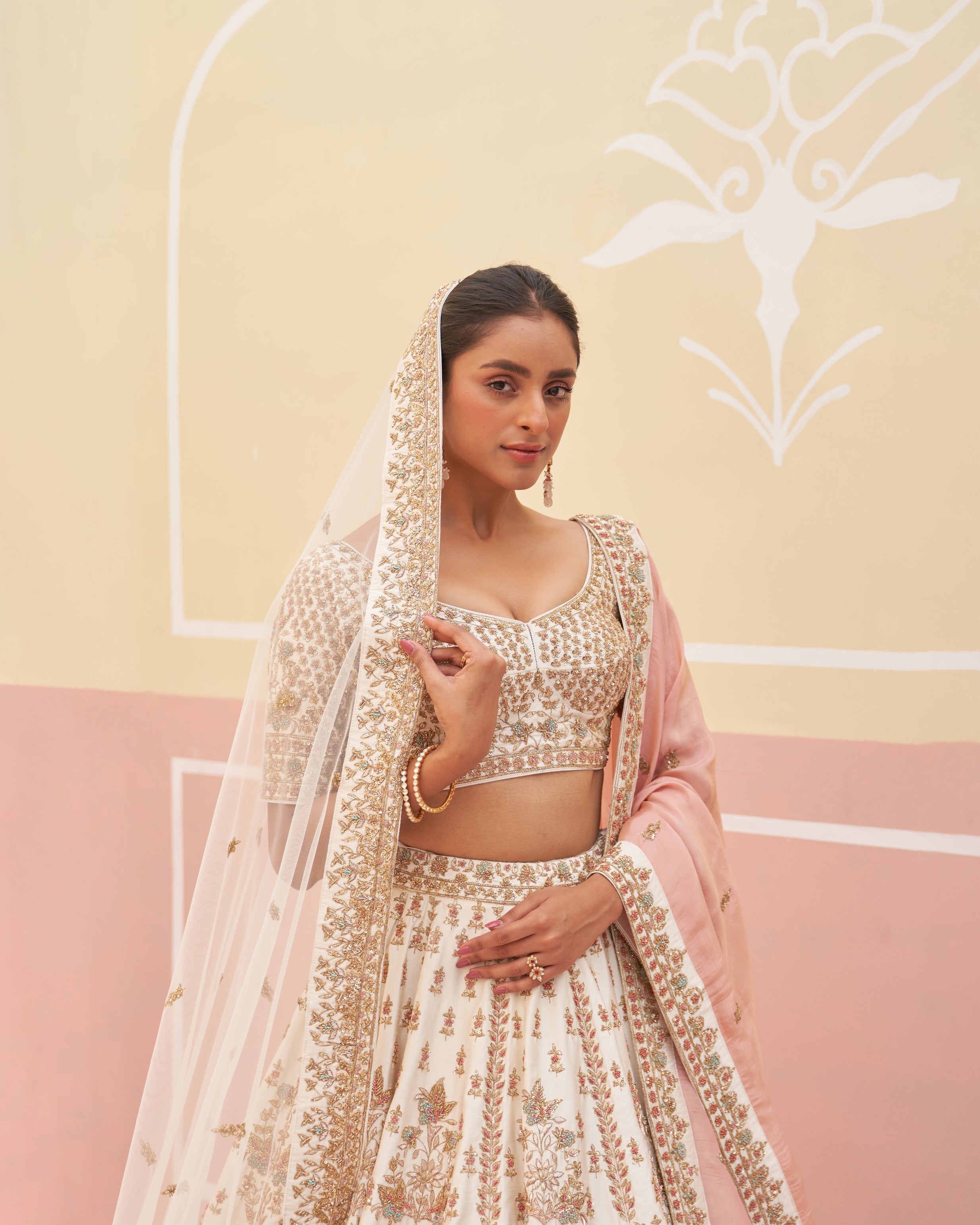 Sophisticated ivory raw silk lehenga set featuring delicate beadwork