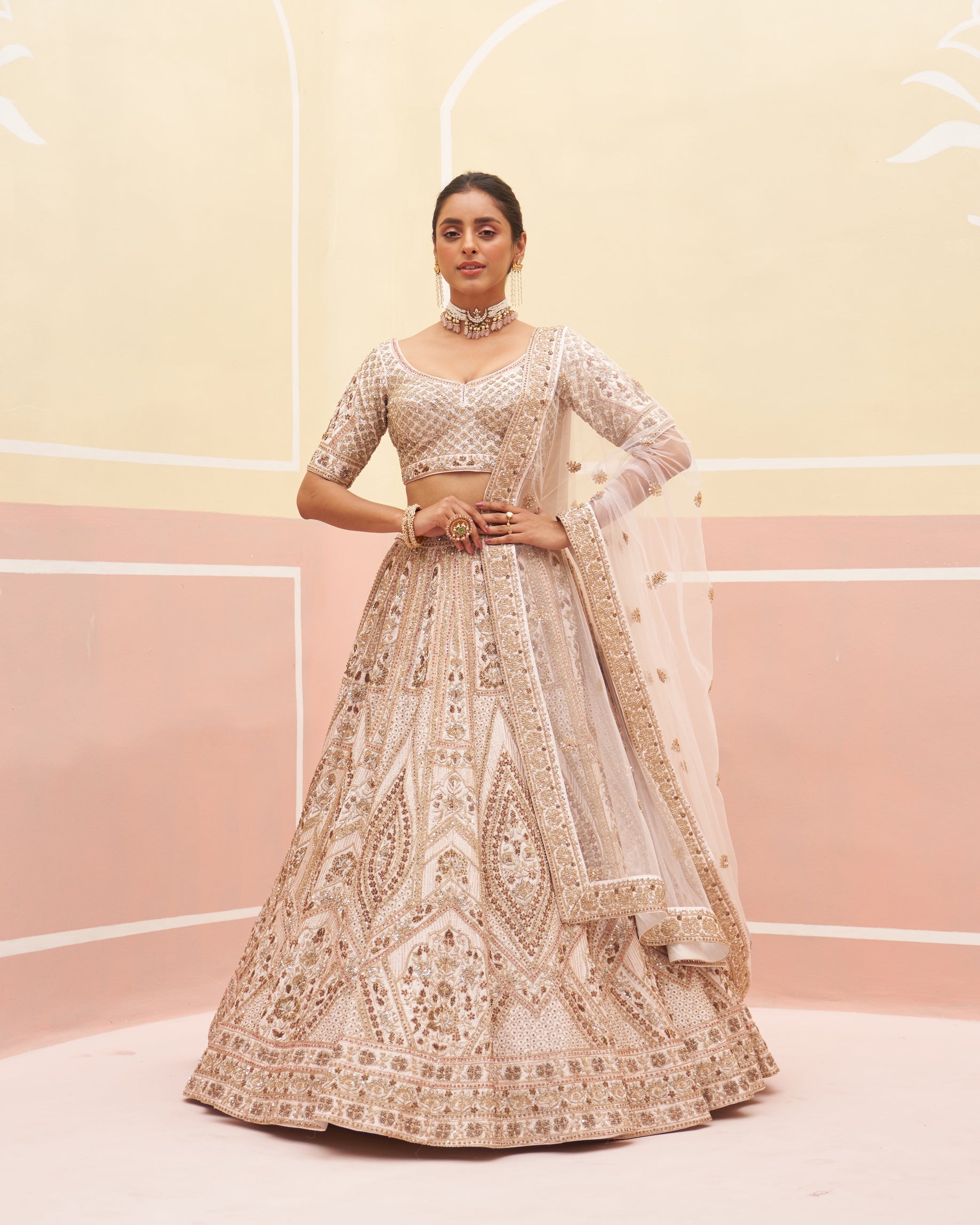 Elegant blush pink raw silk lehenga set with intricate embroidery