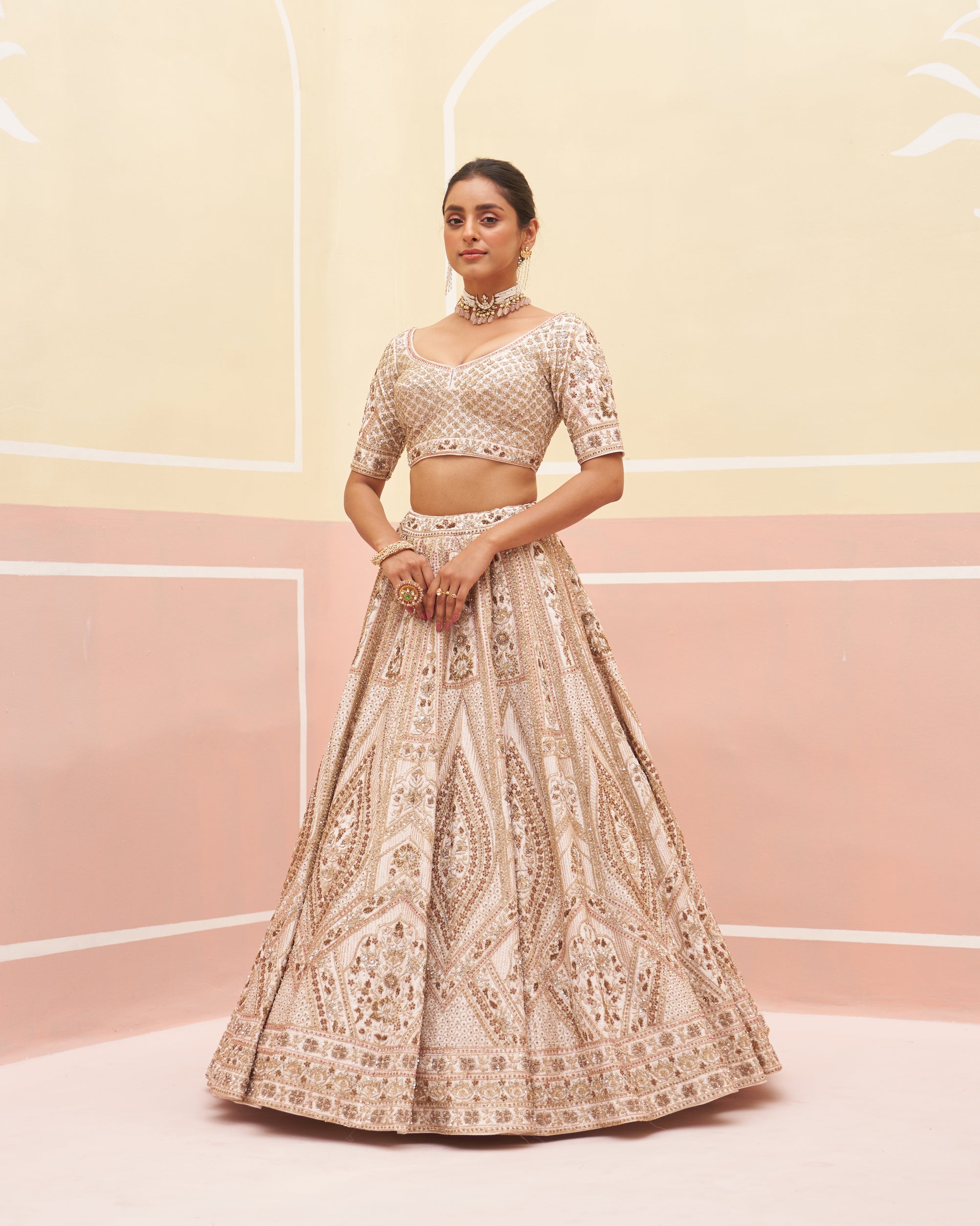 Exquisite blush pink raw silk lehenga set adorned with subtle embellishments