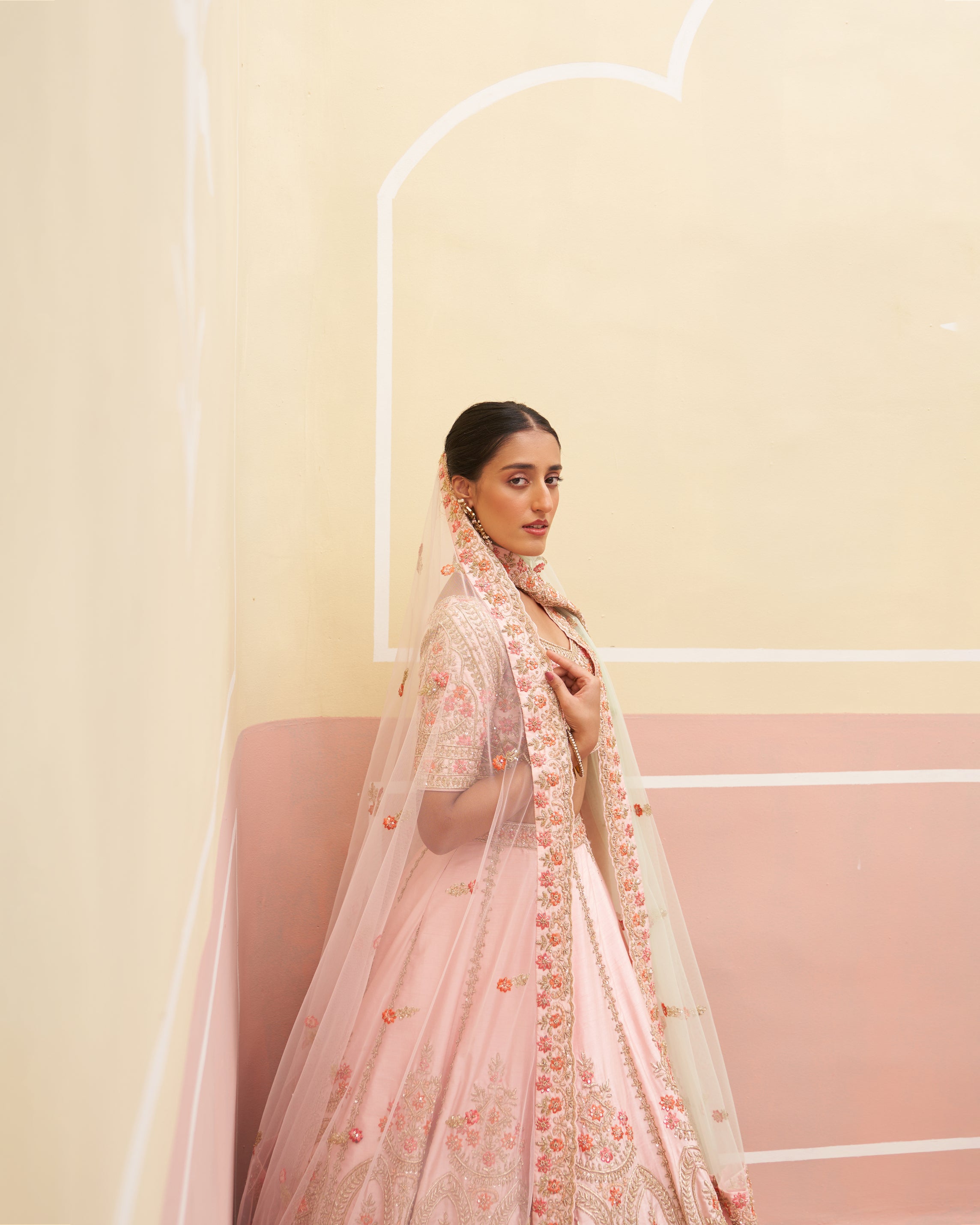 Beautiful pink raw silk lehenga ensemble with intricate craftsmanship