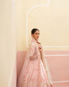 Beautiful pink raw silk lehenga ensemble with intricate craftsmanship