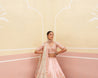 Feminine pink raw silk lehenga set featuring delicate embroidery