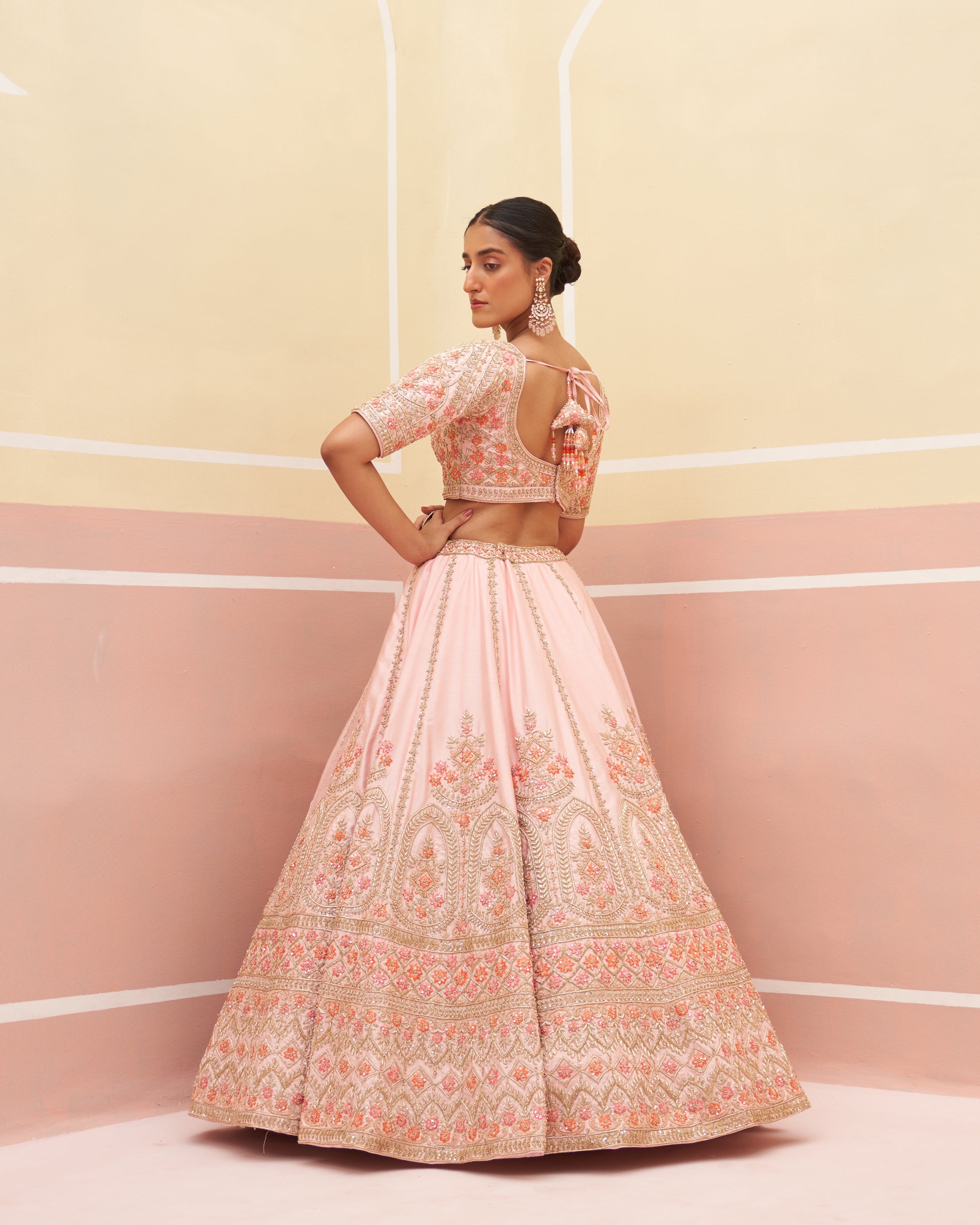 Sophisticated pink raw silk lehenga set with a timeless appeal