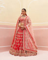 Elegant red raw silk lehenga set with intricate gold embroidery