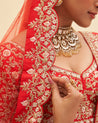 Radiant red raw silk lehenga set with exquisite zari work