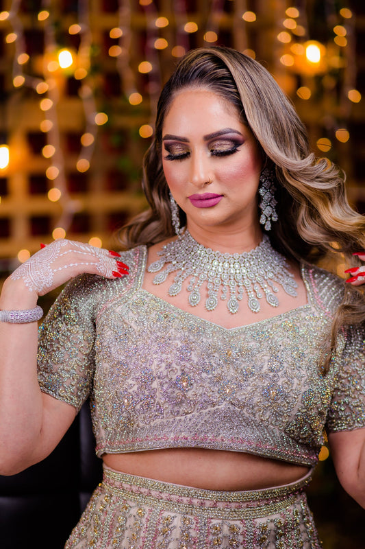Baby Pink Netted Lehenga Choli with heavy Crystal and Sequins handwork