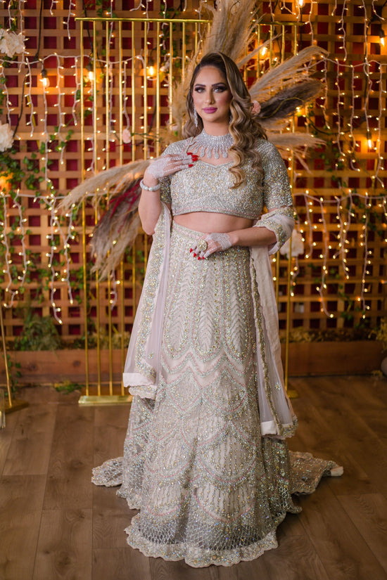 Baby Pink Netted Lehenga Choli with heavy Crystal and Sequins handwork