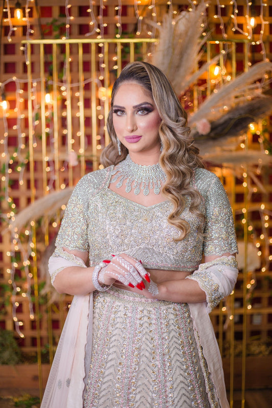 Baby Pink Netted Lehenga Choli with heavy Crystal and Sequins handwork