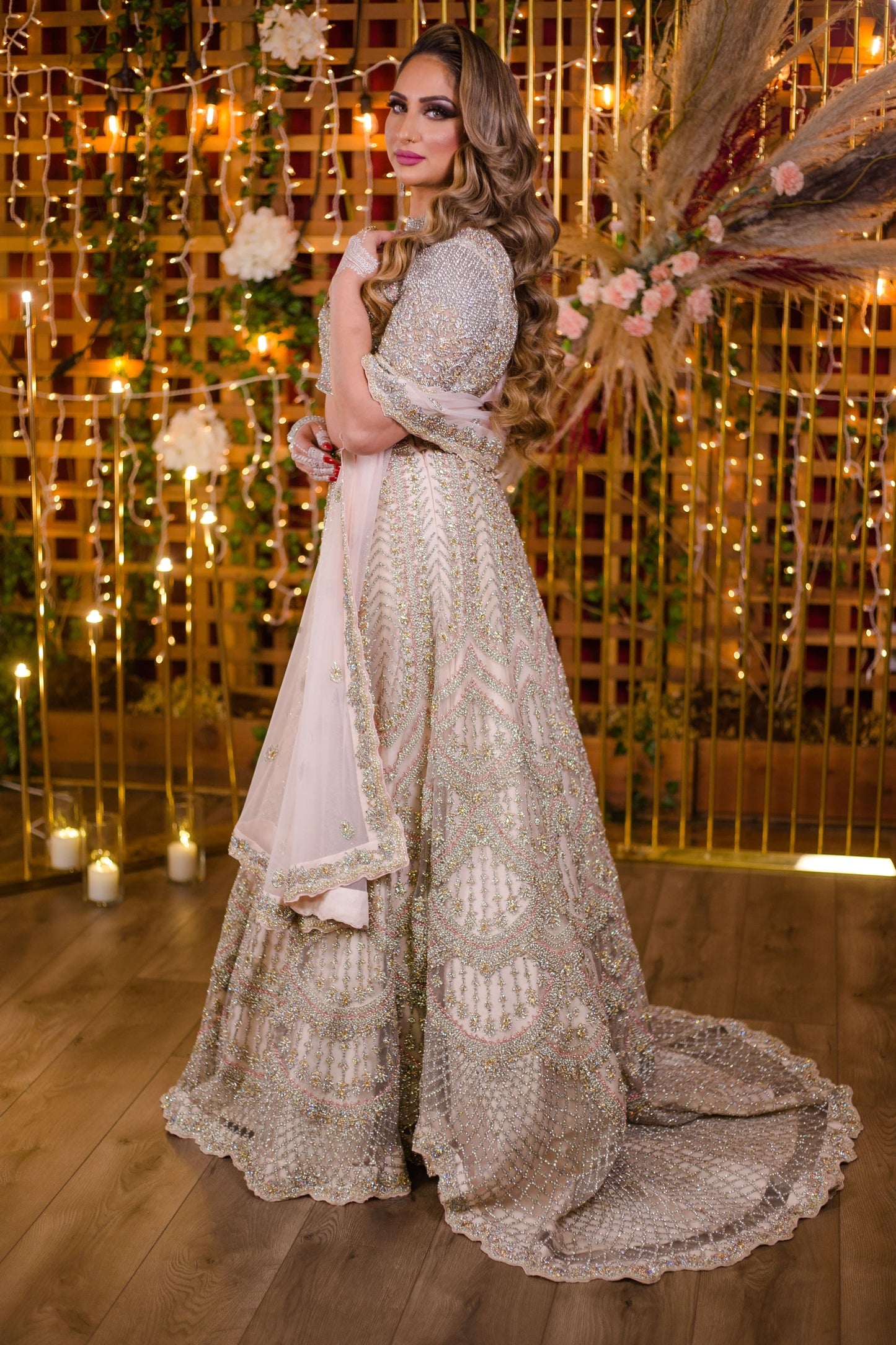 Baby Pink Netted Lehenga Choli with heavy Crystal and Sequins handwork