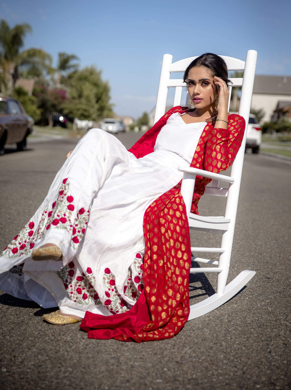 White lehenga set with a red jacket