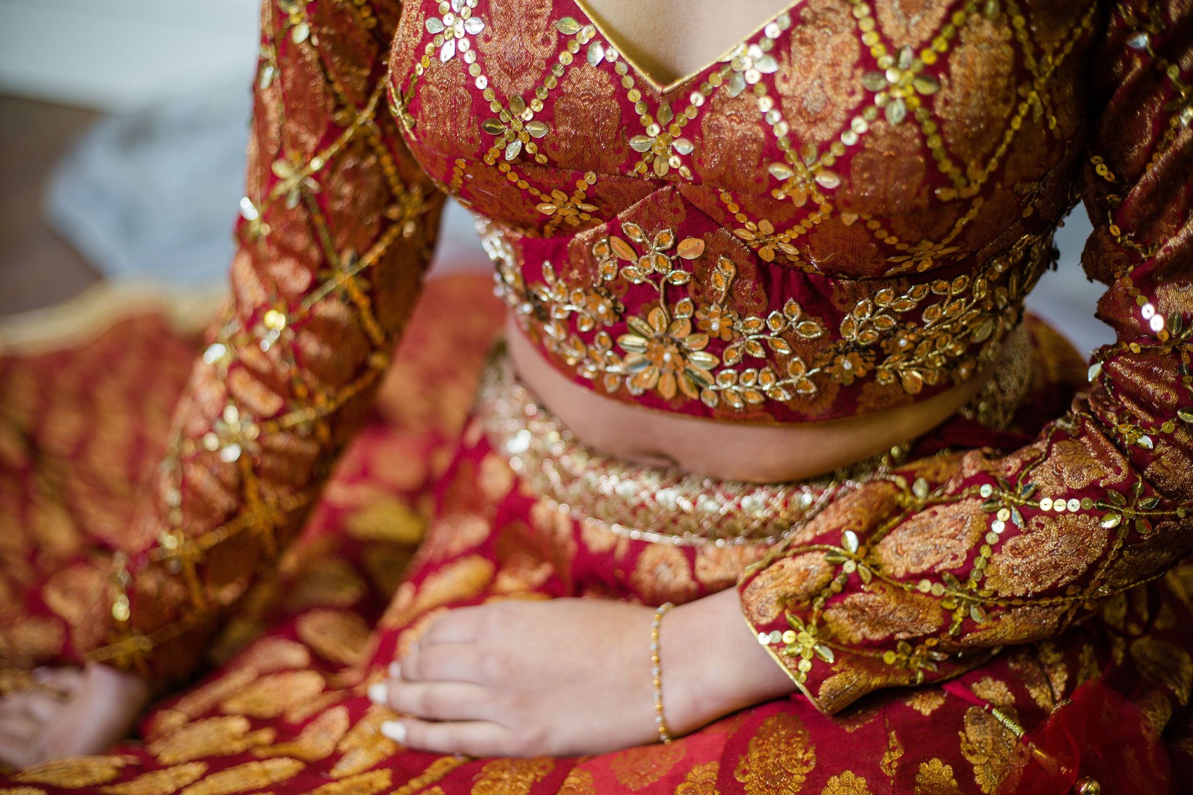 Photo of Bride showing off red and gold bridal lehenga | Indian bridal dress,  Bridal lehenga red, Bridal dress design