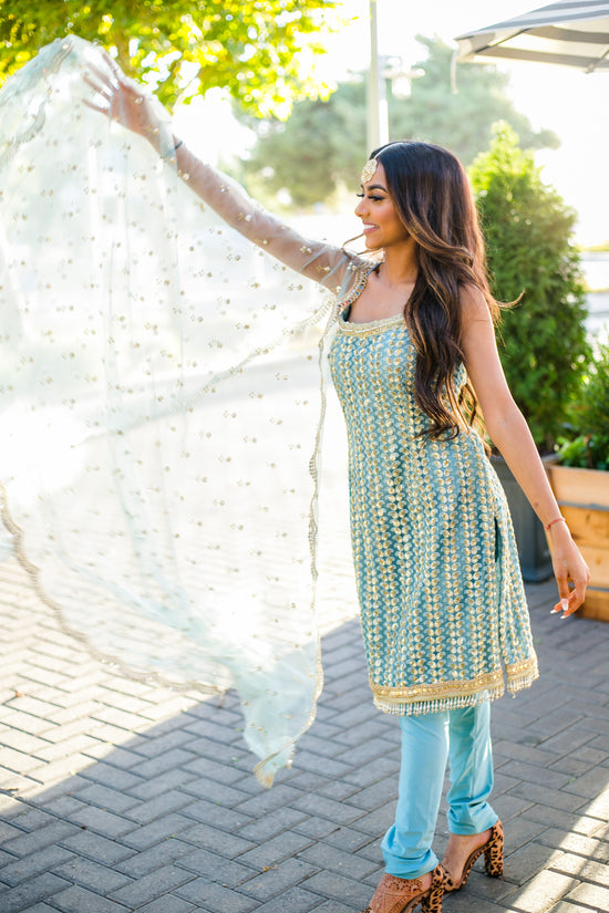 Free Photos - A Young Woman Wearing Traditional Indian Clothing, Such As A  Black Shirt And A Gold-colored Scarf. She Is Posing For The Photo, Exuding  Grace And Poise. The Backdrop Consists