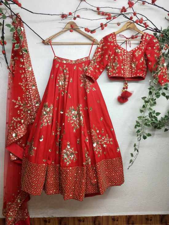 Load image into Gallery viewer, Classic red raw silk Bridal Lehenga choli with Dabka &amp;amp; Sequin embroidery
