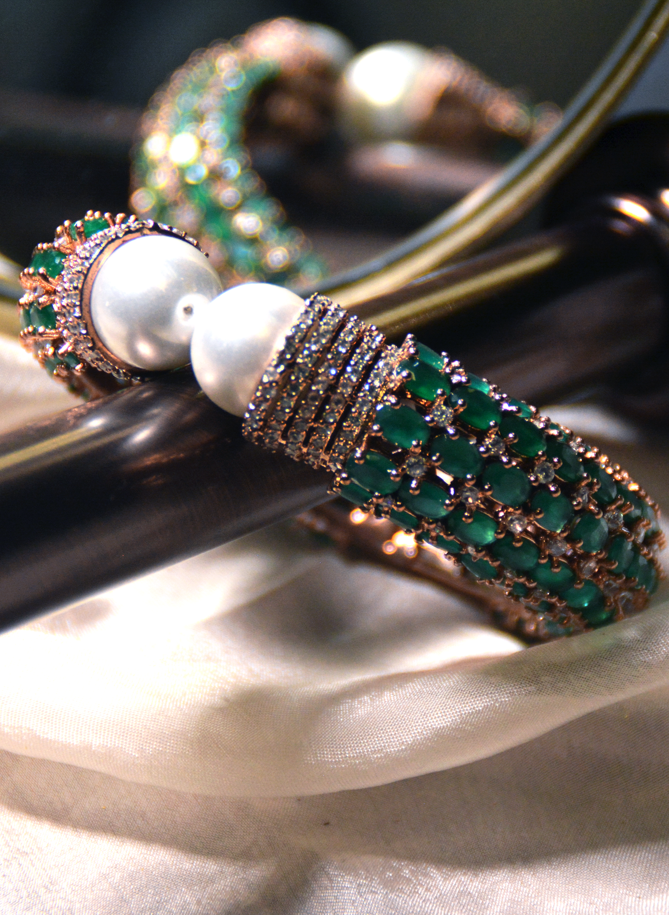 Luxurious cuff bracelet with emeralds & pearl ends