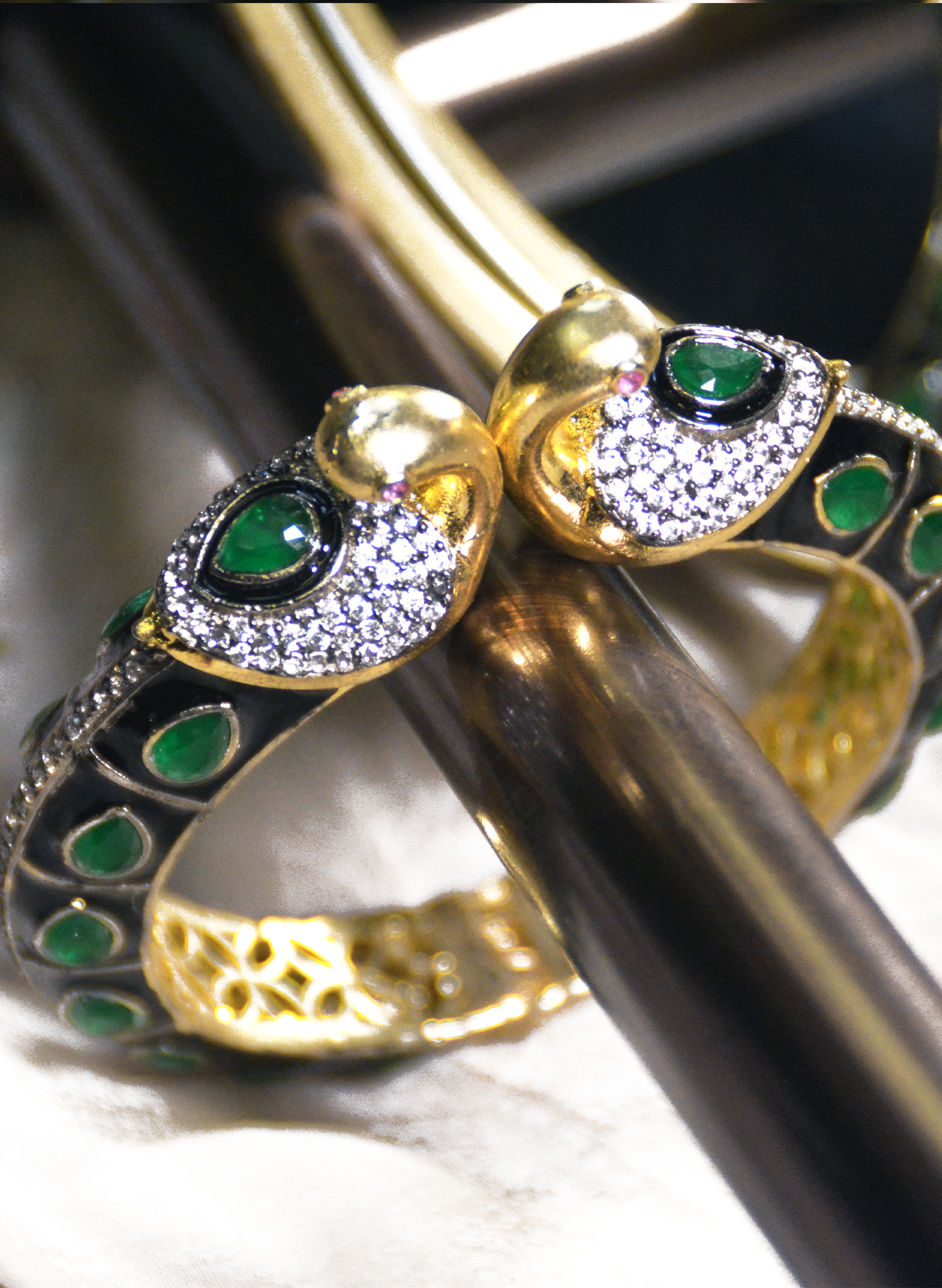 Swan cuff bracelet with emeralds